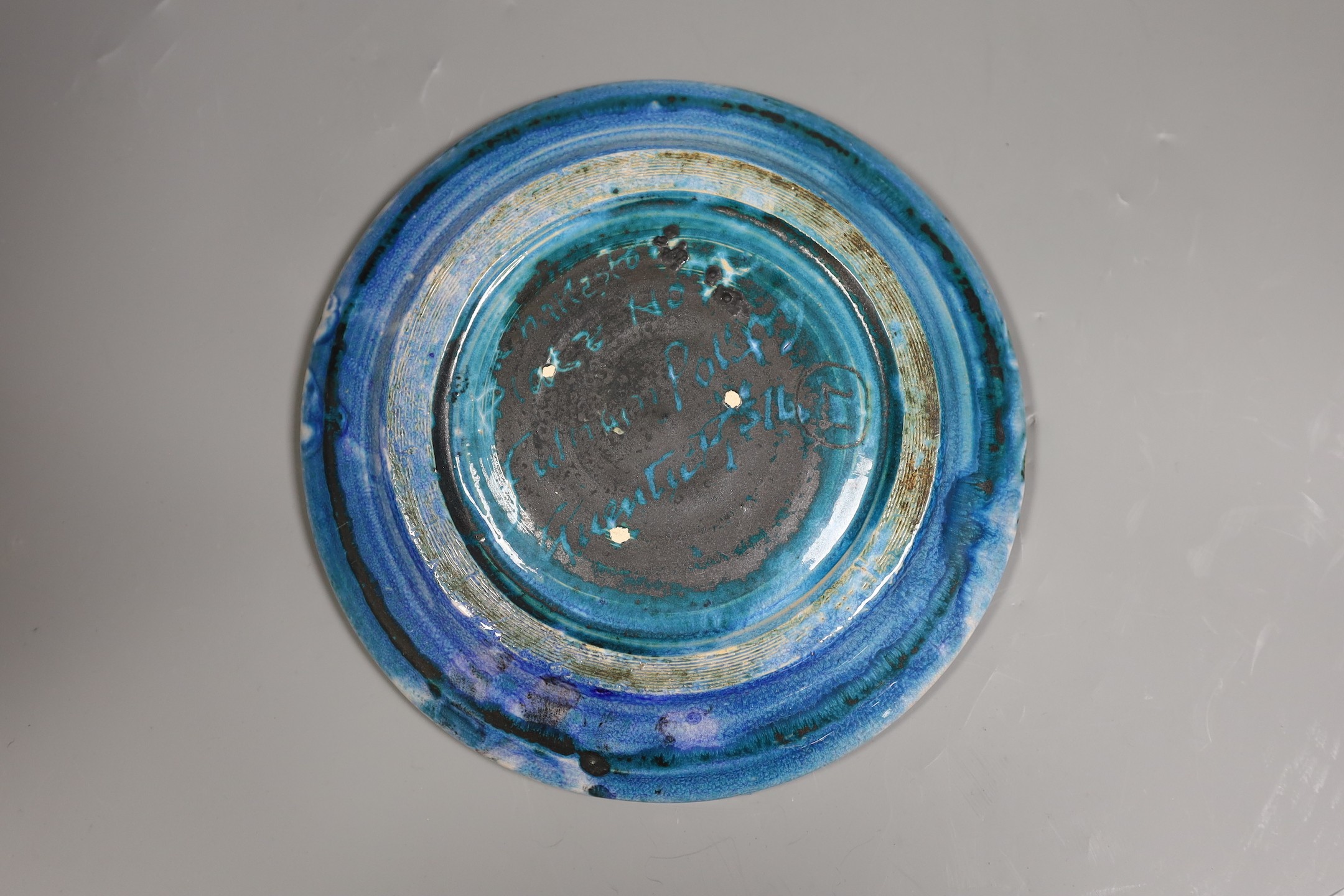 Quentin Bell, Fulham pottery blue glazed wall plate, 23 cms diameter